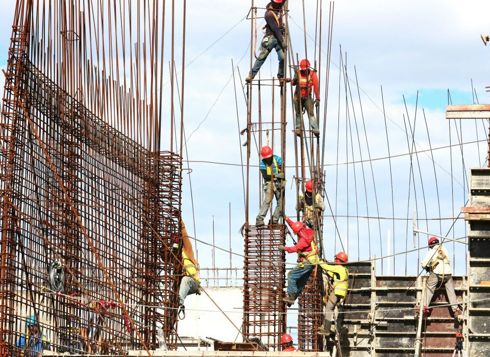 Construction workers on a high-rise rebar structure